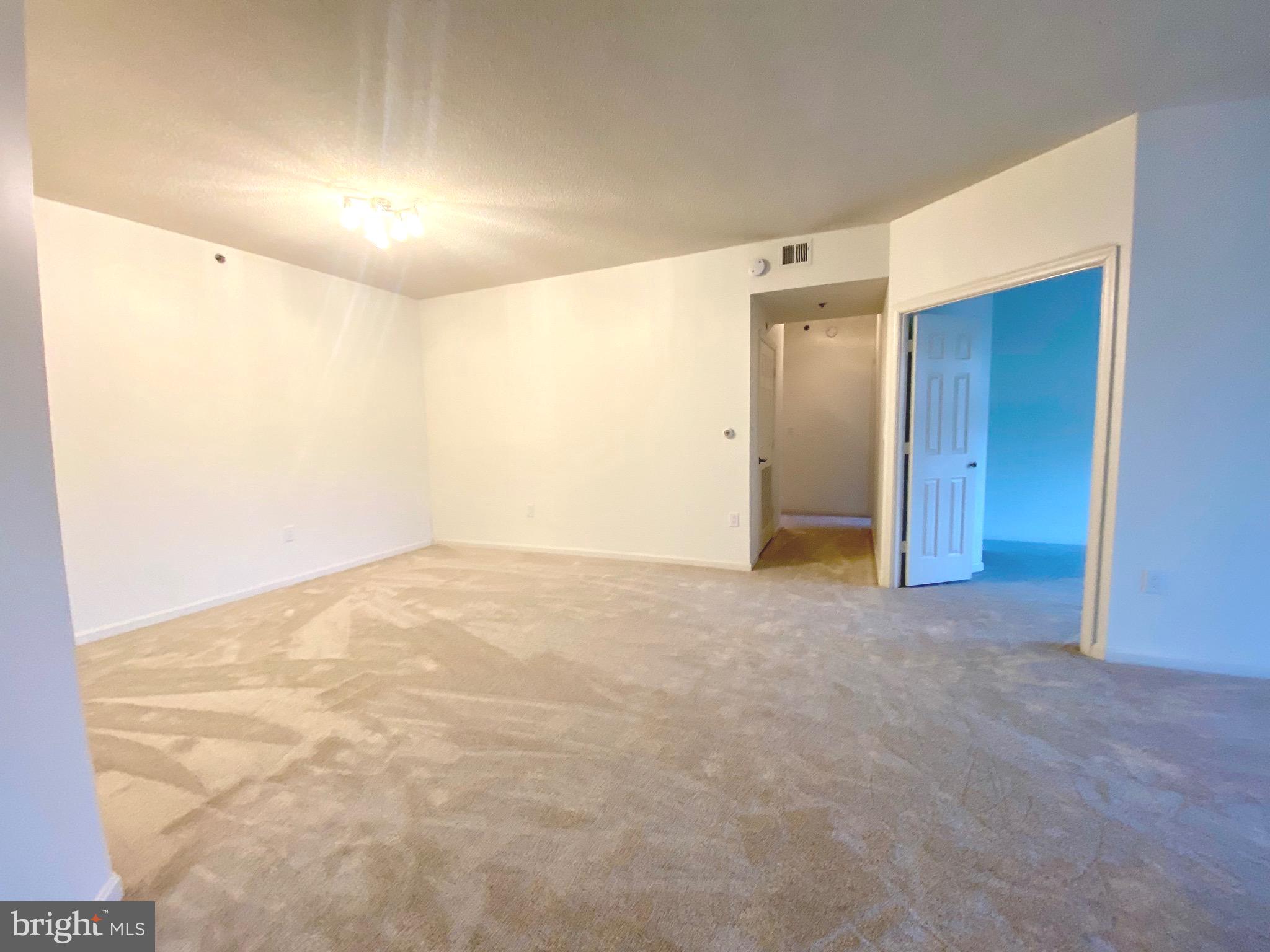 3200 North Leisure World Boulevard, Unit 115 Silver Spring, MD 20906 - Photo 7 of 28 a view of an empty room