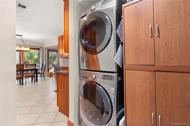 a view of a hallway with washer and dryer