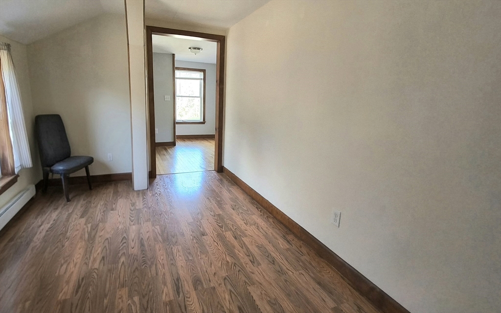 3 Warren Road, Unit B Oxford, MA 01537 - Photo 11 of 16 a view of a hallway with wooden floor and furniture