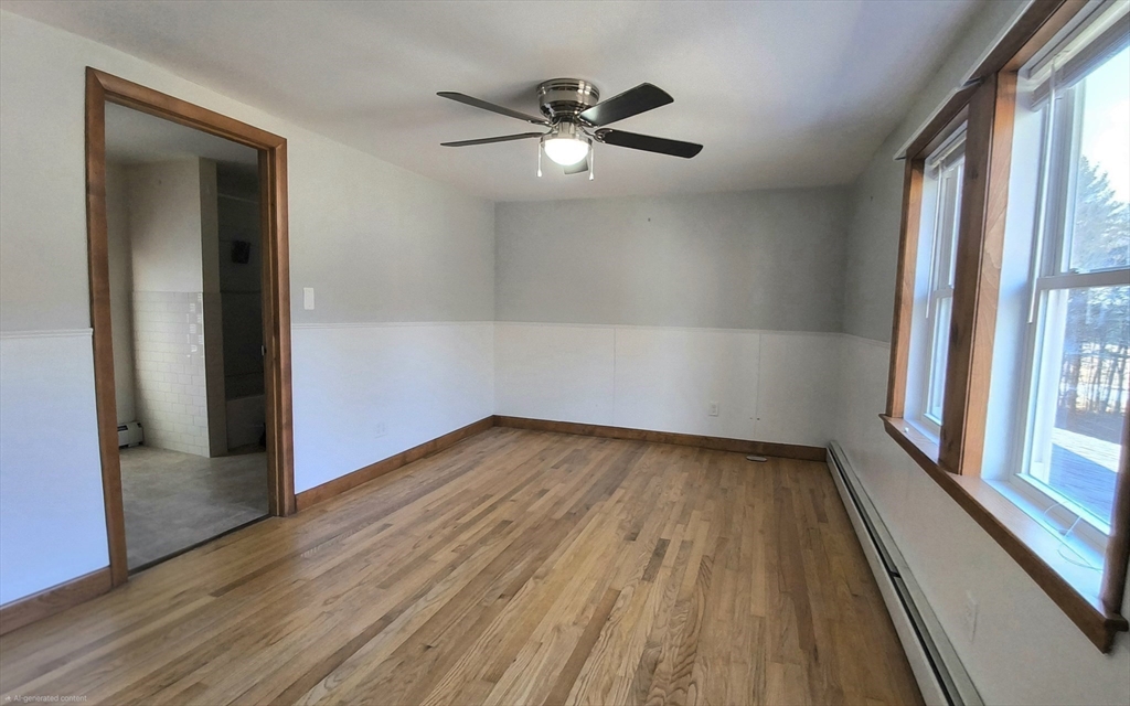 3 Warren Road, Unit B Oxford, MA 01537 - Photo 13 of 16 wooden floor in an empty room with a window