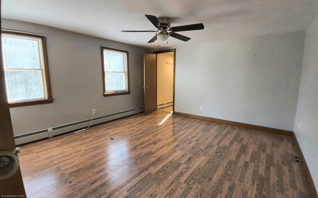 3 Warren Road, Unit B Oxford, MA 01537 - Photo 14 of 16 wooden floor in an empty room with a window