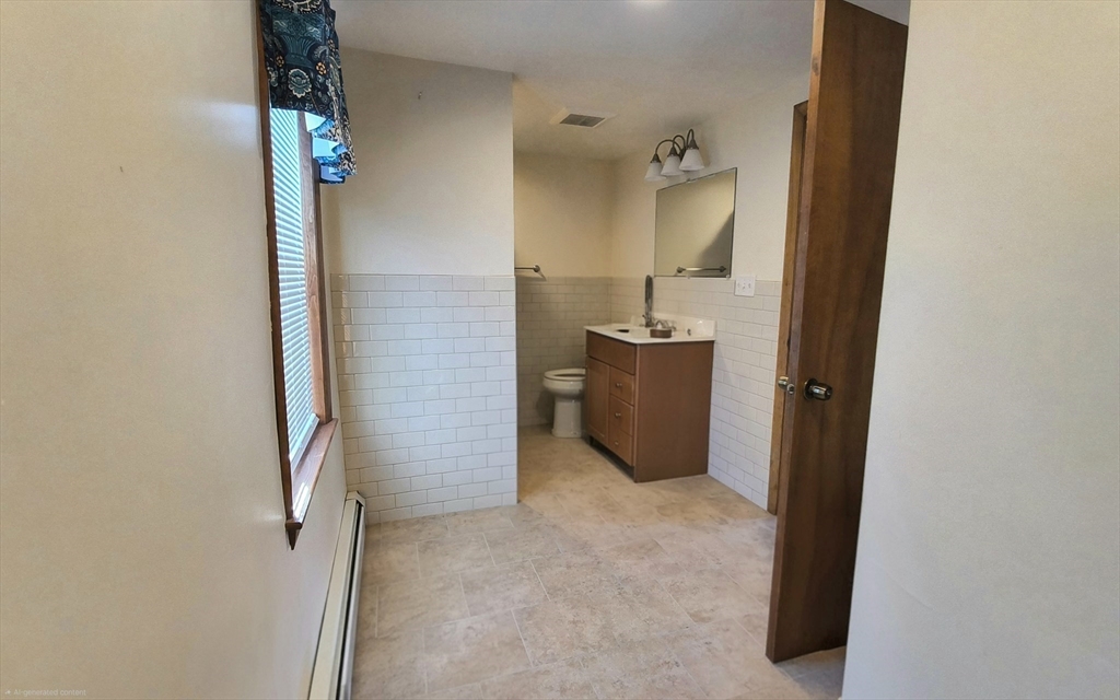 3 Warren Road, Unit B Oxford, MA 01537 - Photo 16 of 16 view of a bathroom with a bathtub a sink and mirror