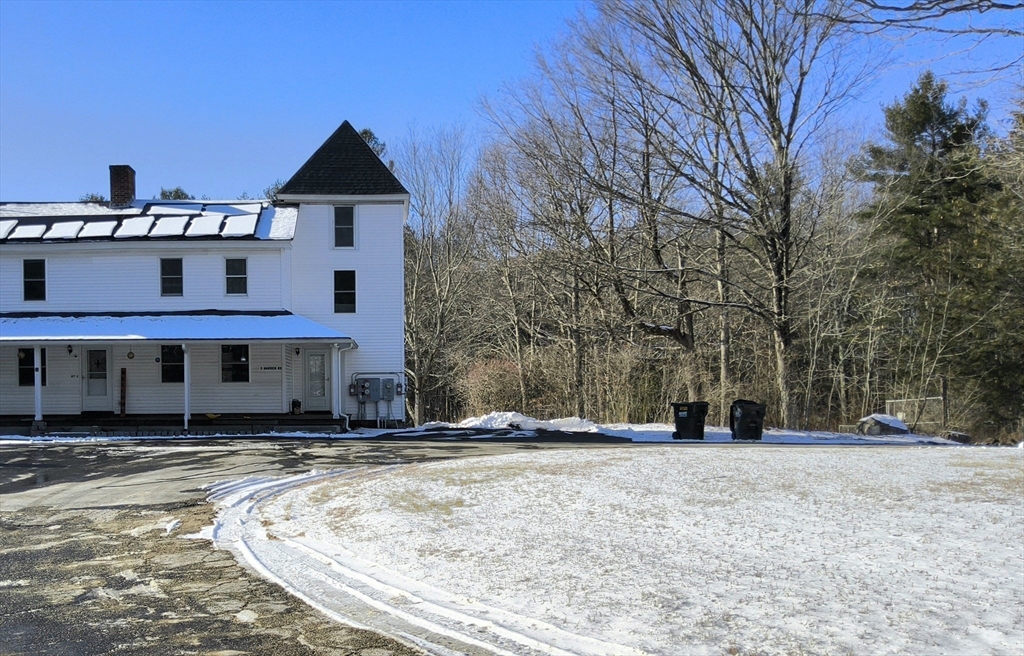 3 Warren Road, Unit B Oxford, MA 01537 - Photo 3 of 16 a view of a house with snow on the road