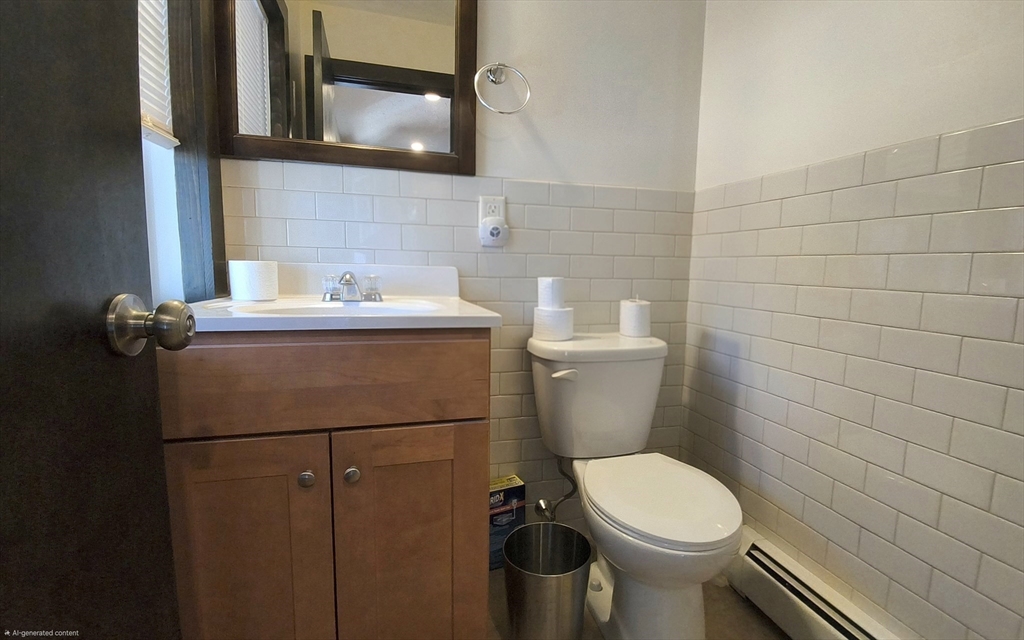 3 Warren Road, Unit B Oxford, MA 01537 - Photo 6 of 16 a bathroom with a toilet sink and mirror