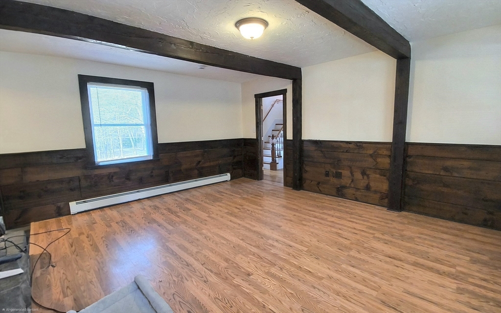 3 Warren Road, Unit B Oxford, MA 01537 - Photo 8 of 16 a room with a bed and a dresser