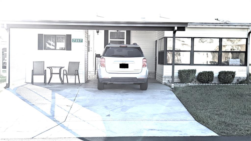 a view of a living room and a balcony