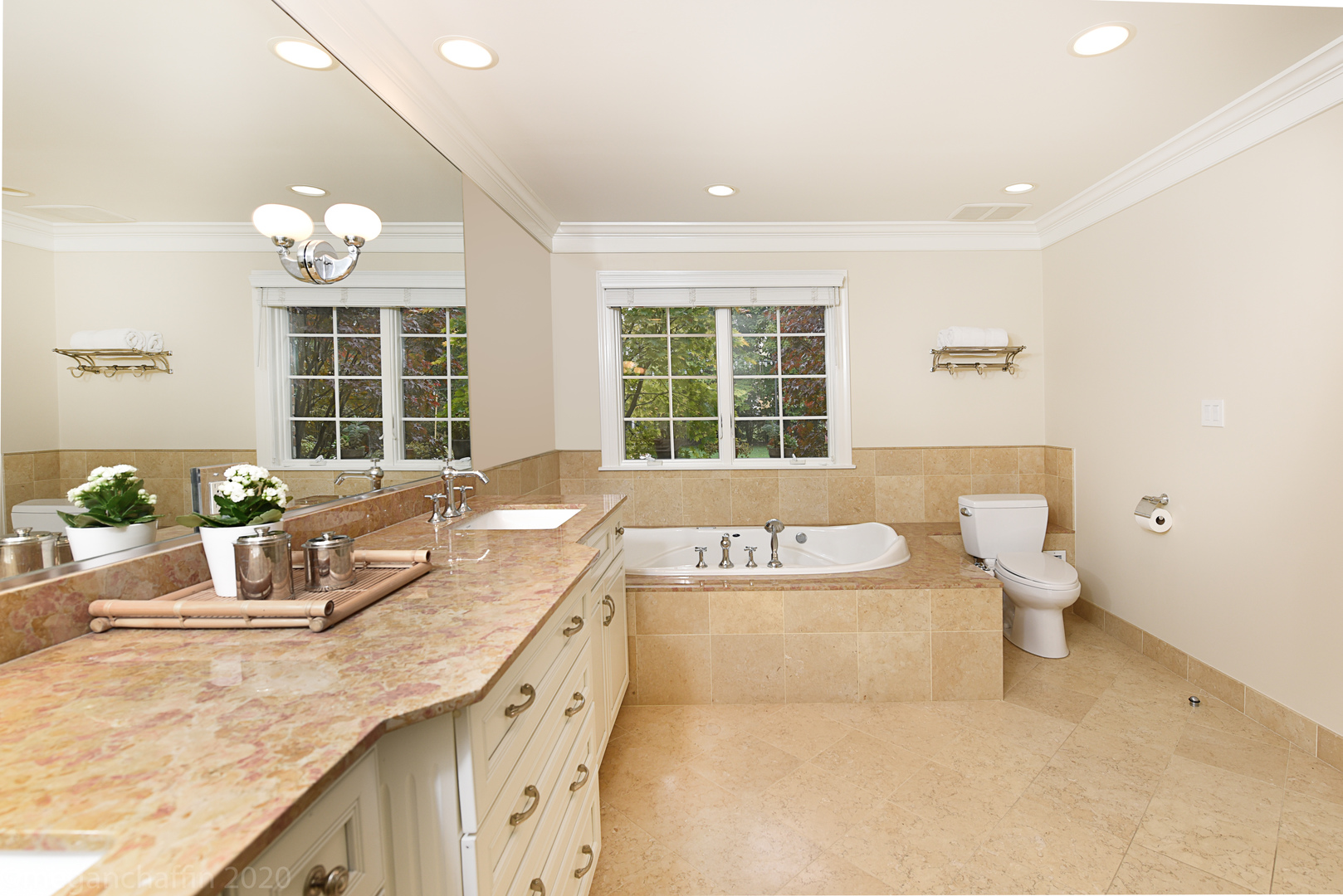 1115 Mohawk Road Wilmette, IL 60091 - Photo 28 of 66 a bathroom with a granite countertop double vanity sink and a bathtub