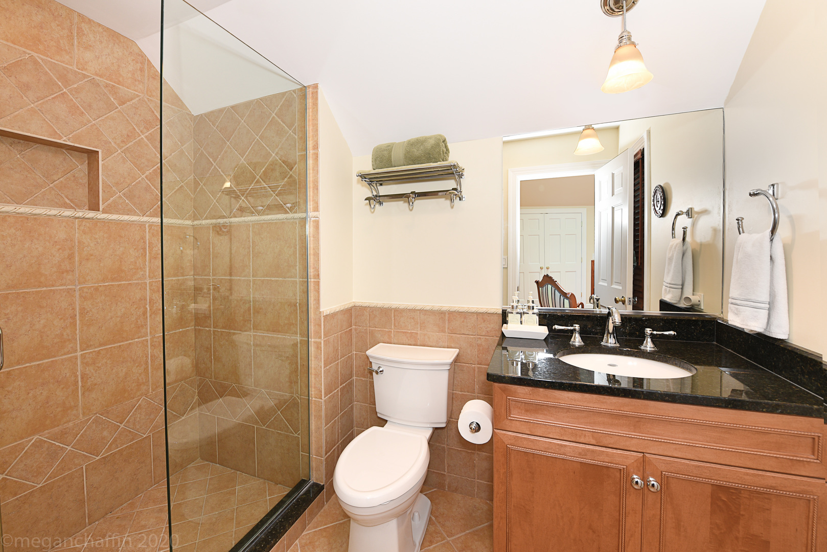 1115 Mohawk Road Wilmette, IL 60091 - Photo 43 of 66 a bathroom with a toilet a sink and mirror