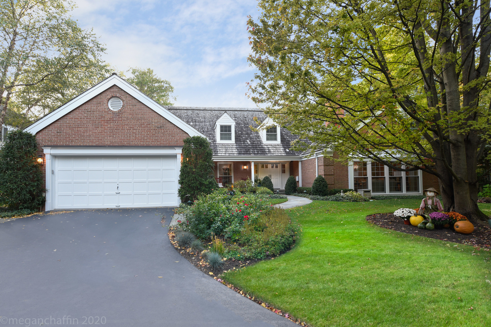 1115 Mohawk Road Wilmette, IL 60091 - Photo 51 of 66 a front view of a house with a garden and trees