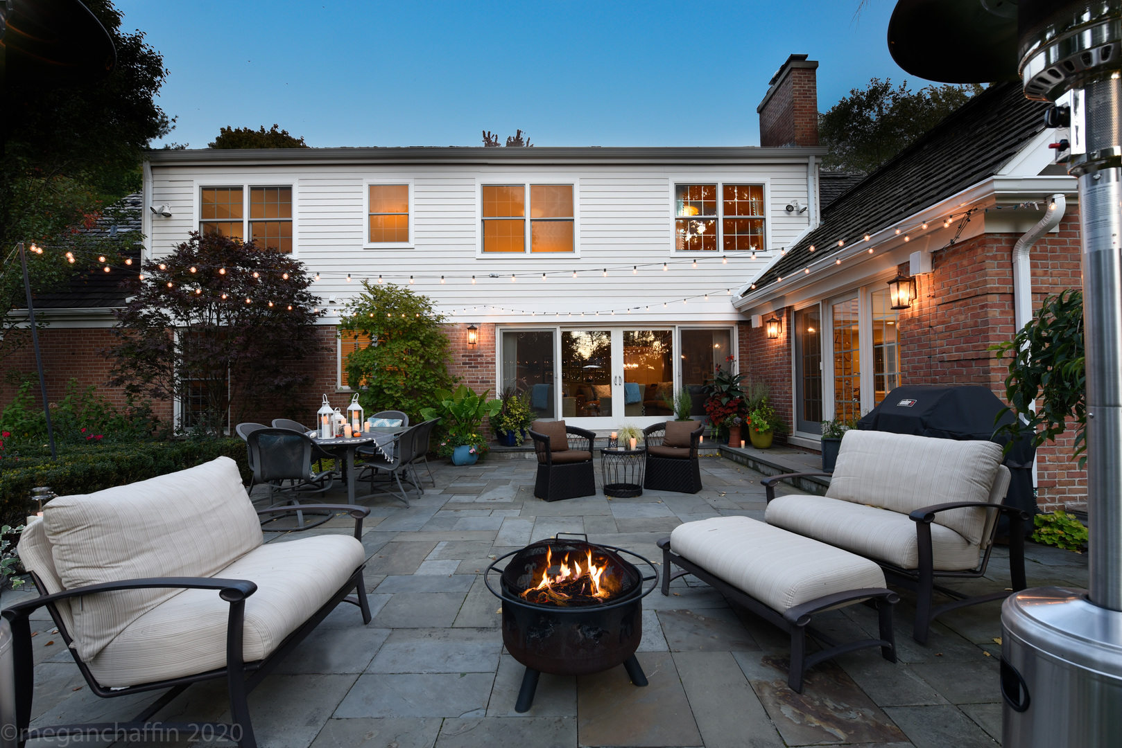 1115 Mohawk Road Wilmette, IL 60091 - Photo 52 of 66 a view of a patio with couches table and chairs and potted plants