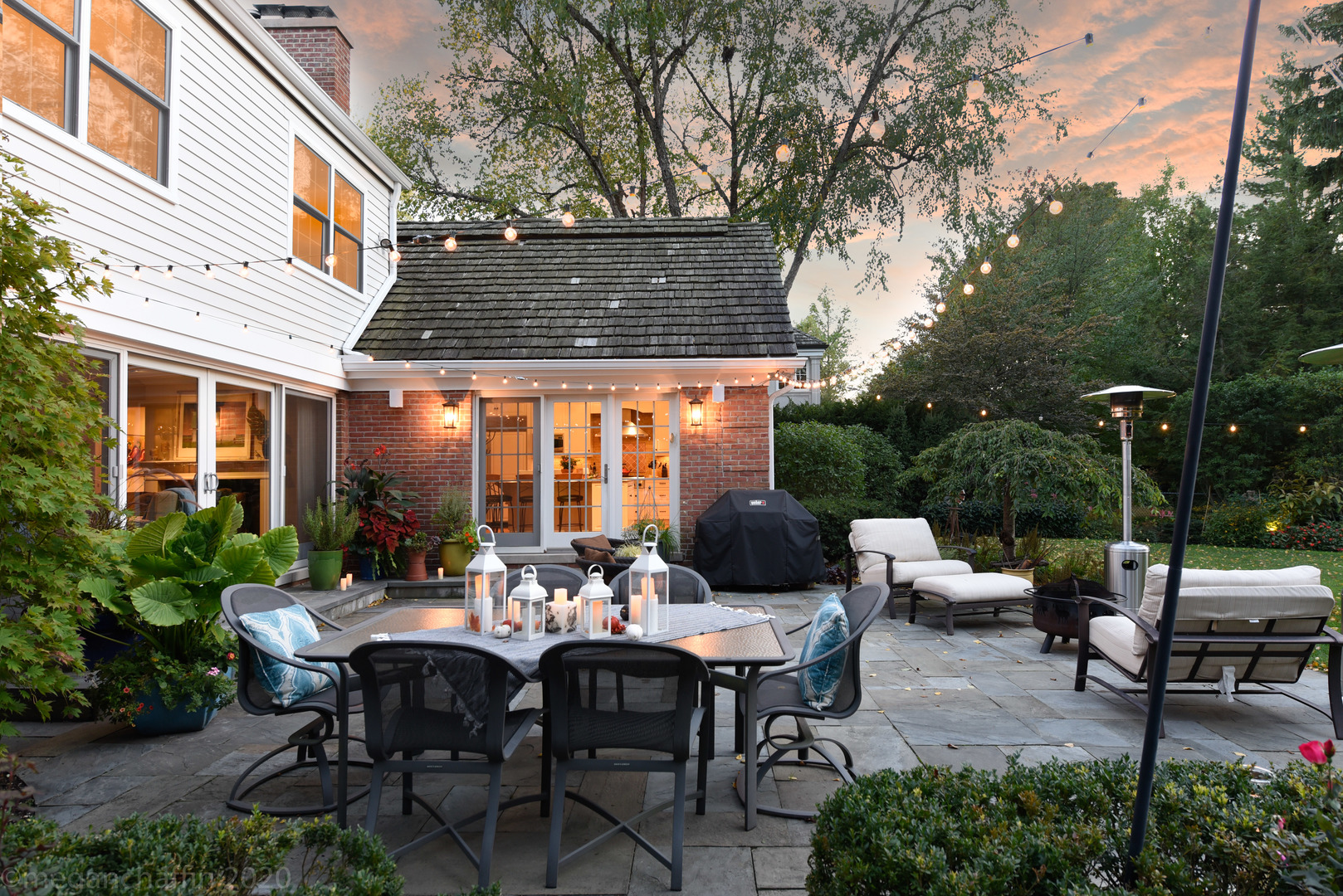 1115 Mohawk Road Wilmette, IL 60091 - Photo 59 of 66 a view of a patio with a dining table and chairs with a small yard