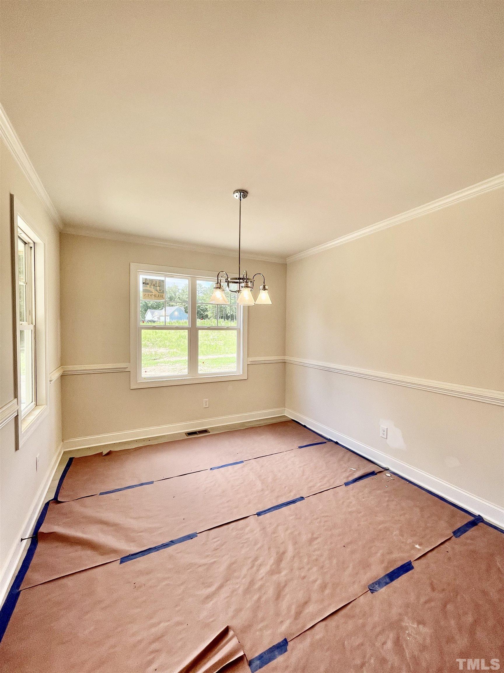 1428 Old Watkins Road Raleigh, NC 27616 - Photo 11 of 36 a view of an empty room with a window