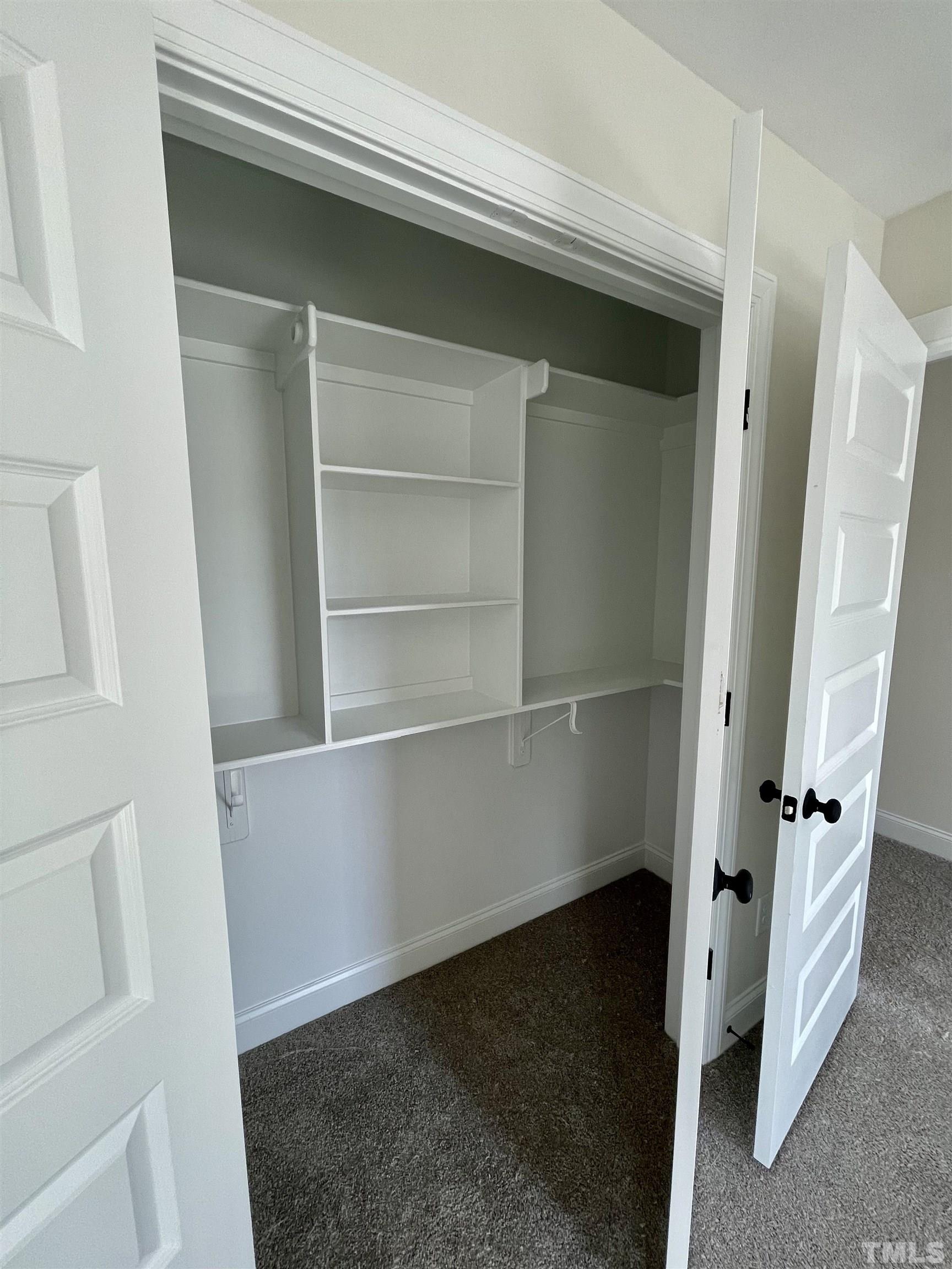 1428 Old Watkins Road Raleigh, NC 27616 - Photo 23 of 36 a view of an empty walk in closet