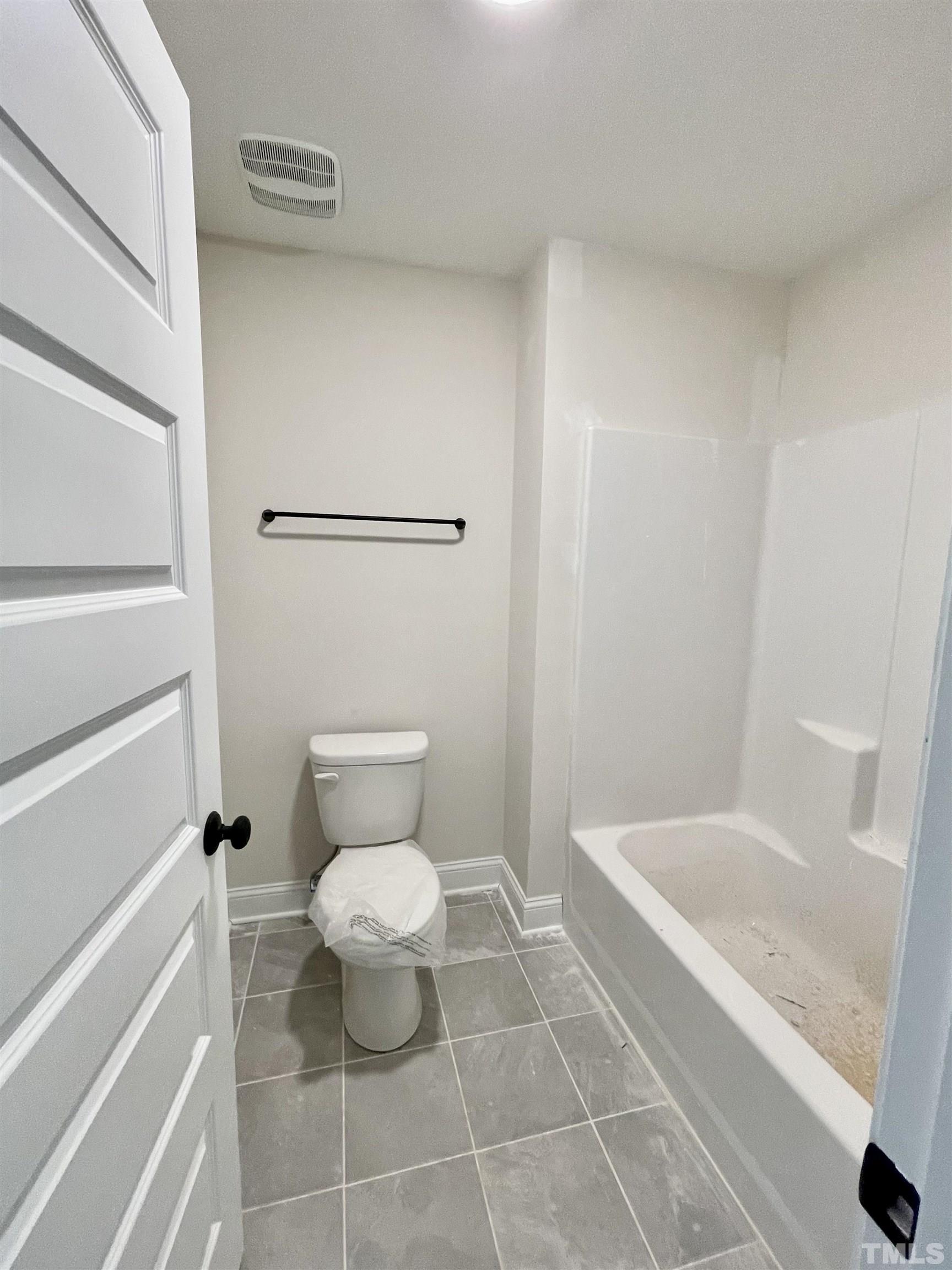 1428 Old Watkins Road Raleigh, NC 27616 - Photo 24 of 36 a bathroom with a toilet and a shower