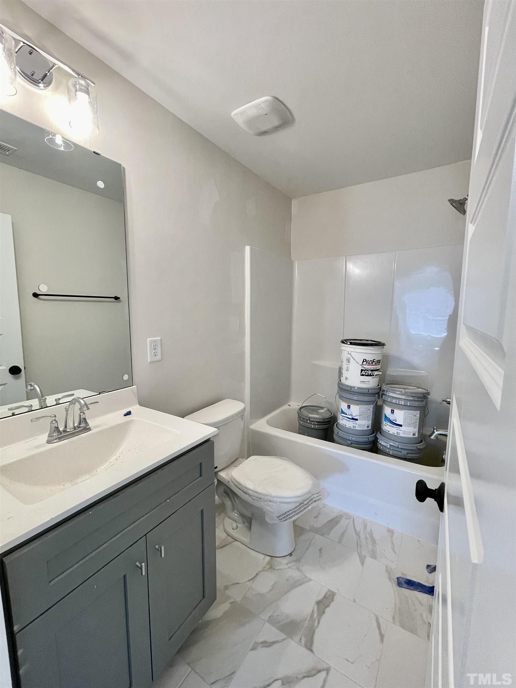 1428 Old Watkins Road Raleigh, NC 27616 - Photo 27 of 36 a spacious bathroom with a double vanity sink and a mirror