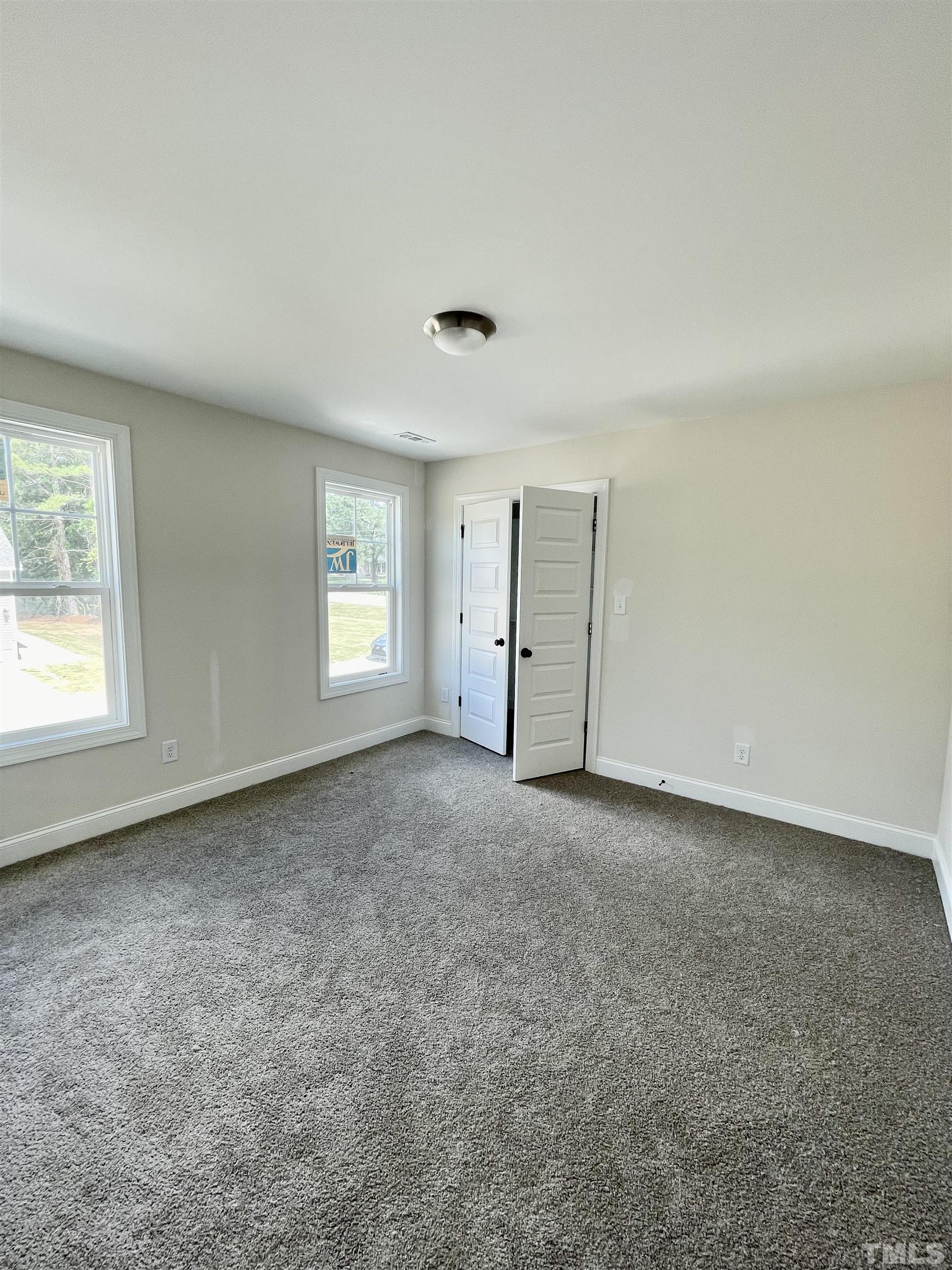 1428 Old Watkins Road Raleigh, NC 27616 - Photo 28 of 36 an empty room with windows