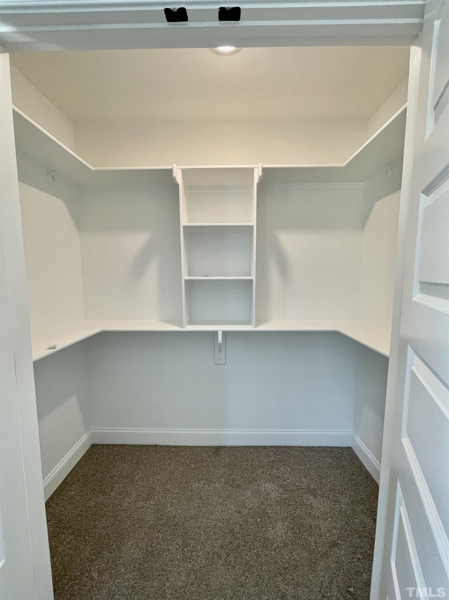 1428 Old Watkins Road Raleigh, NC 27616 - Photo 29 of 36 a view of a room with shelf