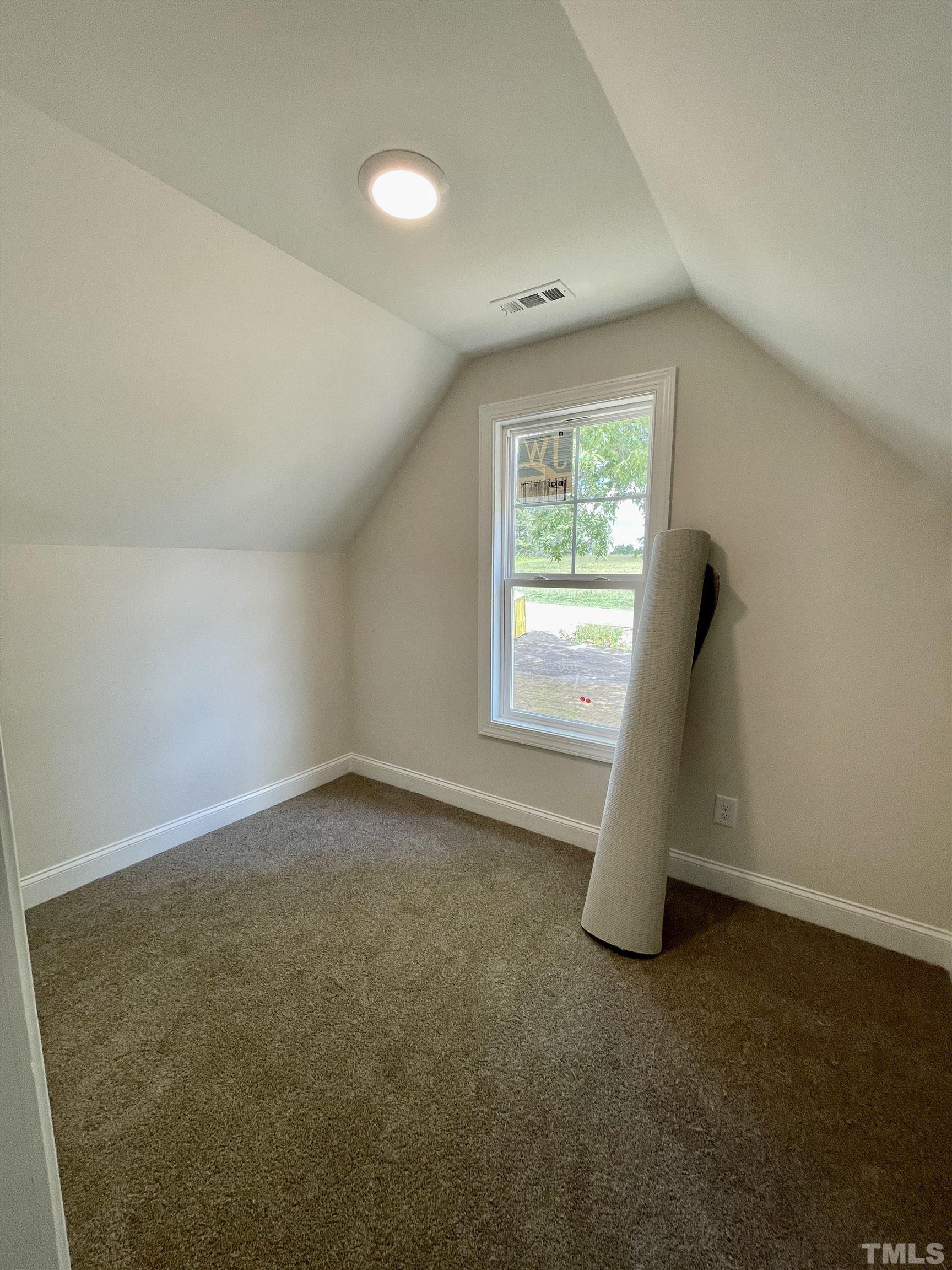1428 Old Watkins Road Raleigh, NC 27616 - Photo 31 of 36 an empty room with windows