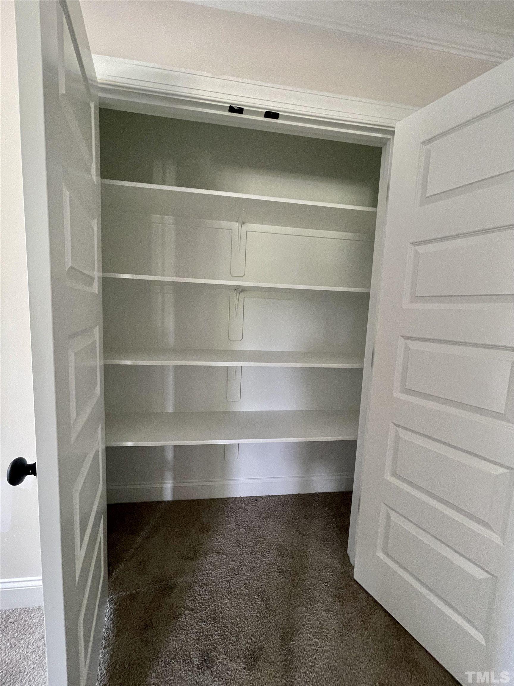 1428 Old Watkins Road Raleigh, NC 27616 - Photo 33 of 36 a view of walk in closet with empty racks