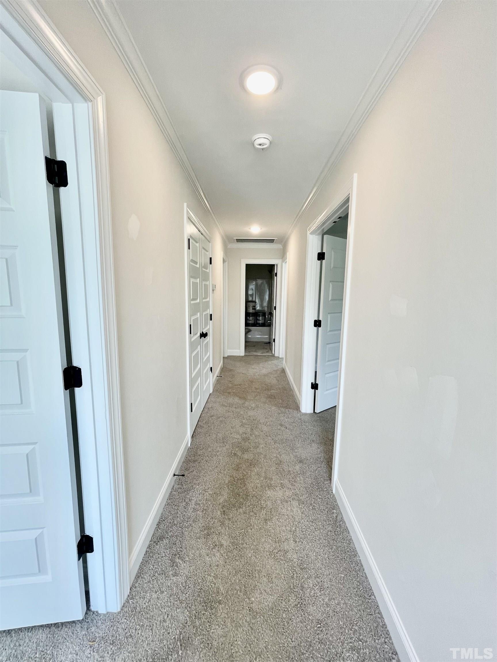1428 Old Watkins Road Raleigh, NC 27616 - Photo 35 of 36 a view of a hallway with wooden shelves