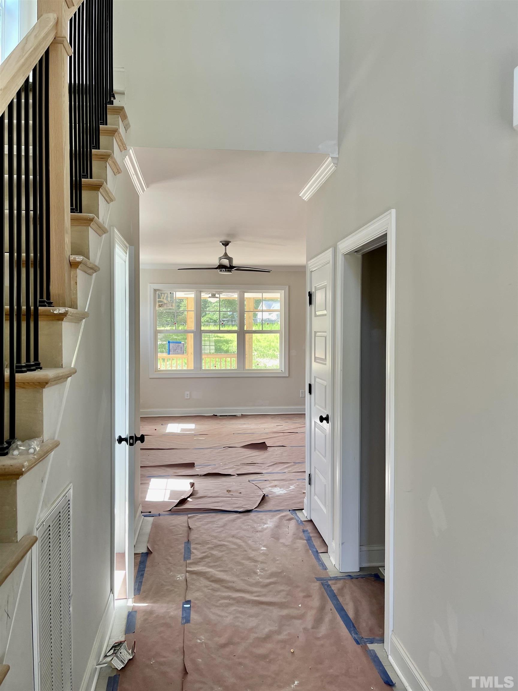 1428 Old Watkins Road Raleigh, NC 27616 - Photo 4 of 36 a view of an entryway with wooden floor and windows