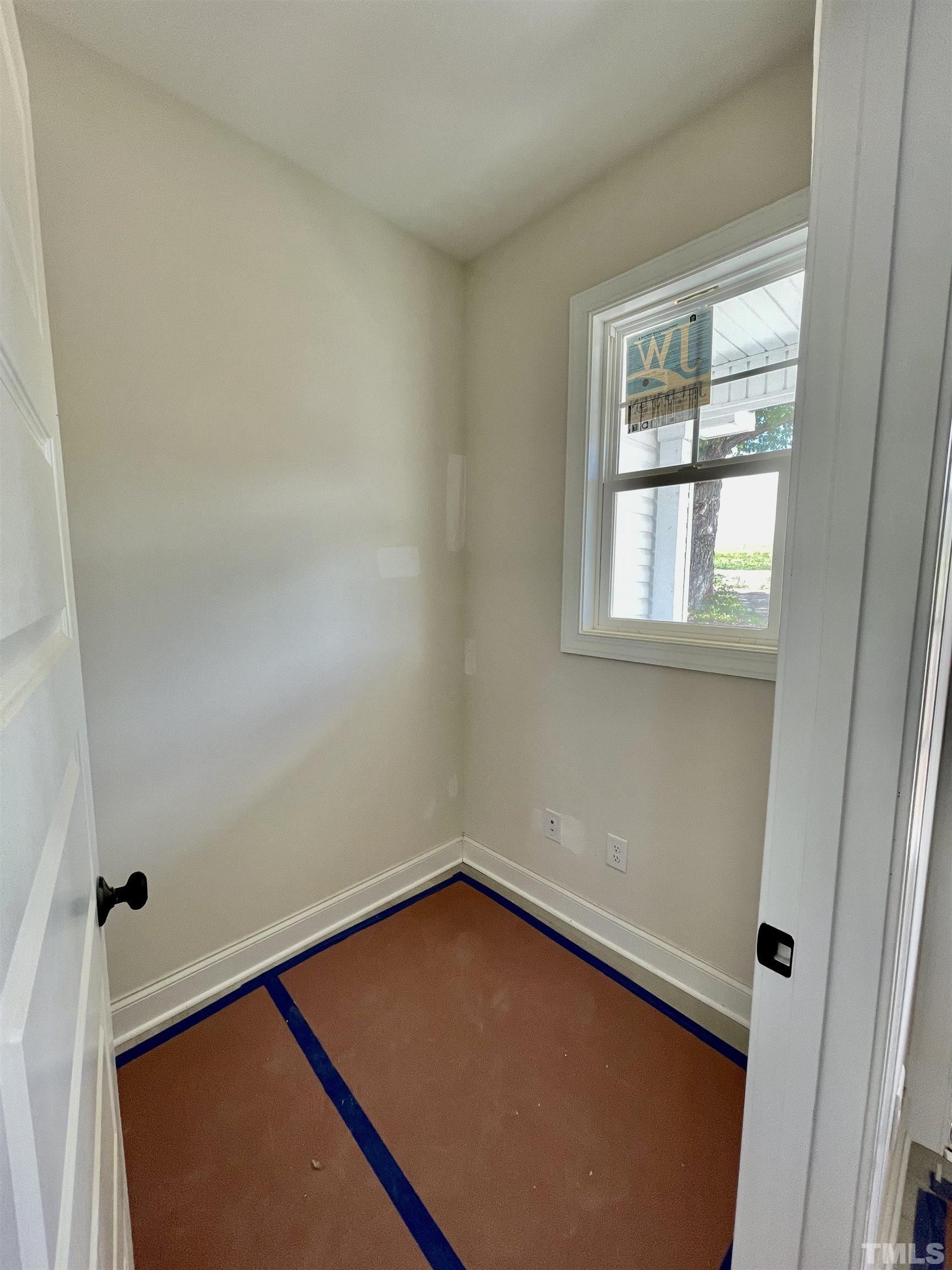 1428 Old Watkins Road Raleigh, NC 27616 - Photo 5 of 36 an empty room with a window
