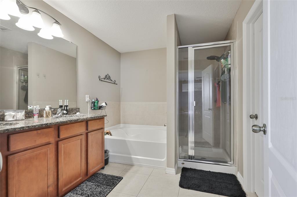 5779 Aaron Court Sarasota, FL 34232 - Photo 17 of 39 a bathroom with a shower and a sink