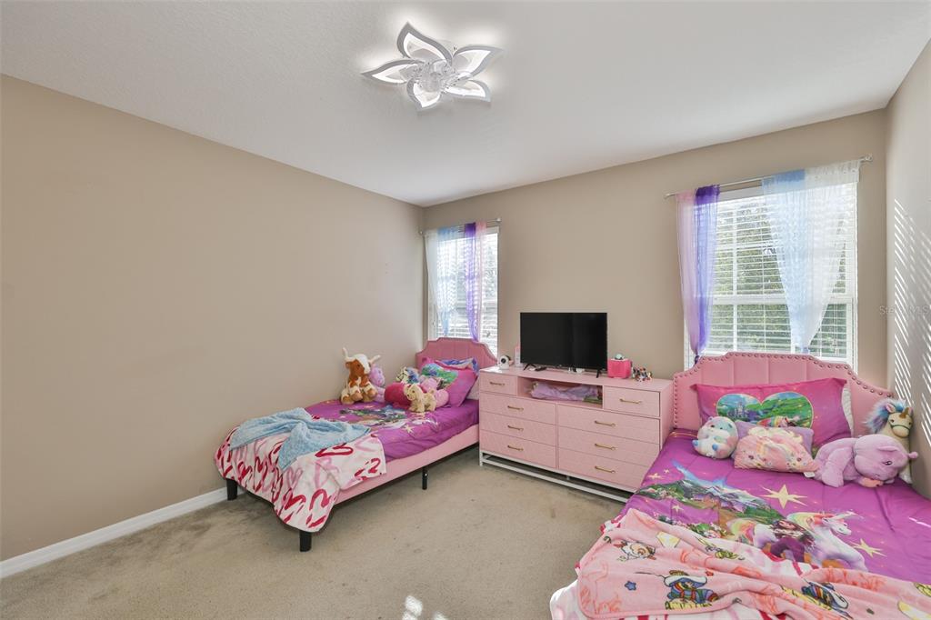 5779 Aaron Court Sarasota, FL 34232 - Photo 19 of 39 a bedroom with bed and a window