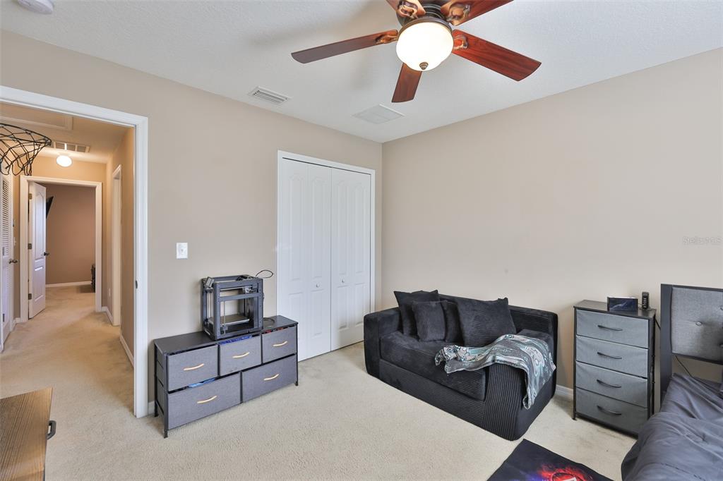 5779 Aaron Court Sarasota, FL 34232 - Photo 22 of 39 a living room with furniture and a flat screen tv