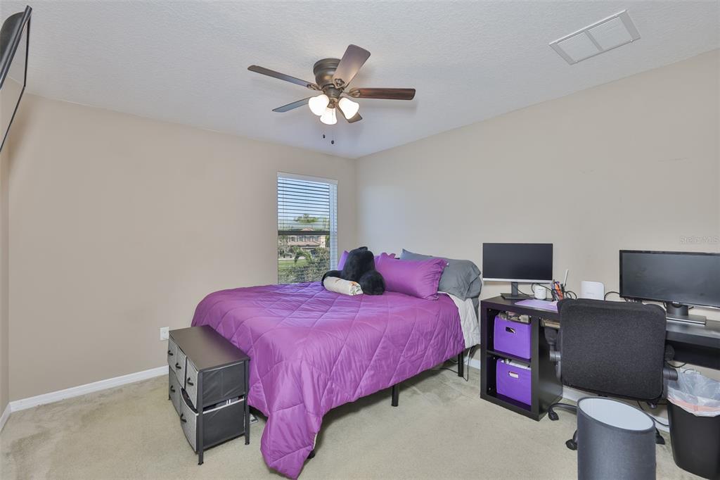 5779 Aaron Court Sarasota, FL 34232 - Photo 23 of 39 a bedroom with a bed and a window