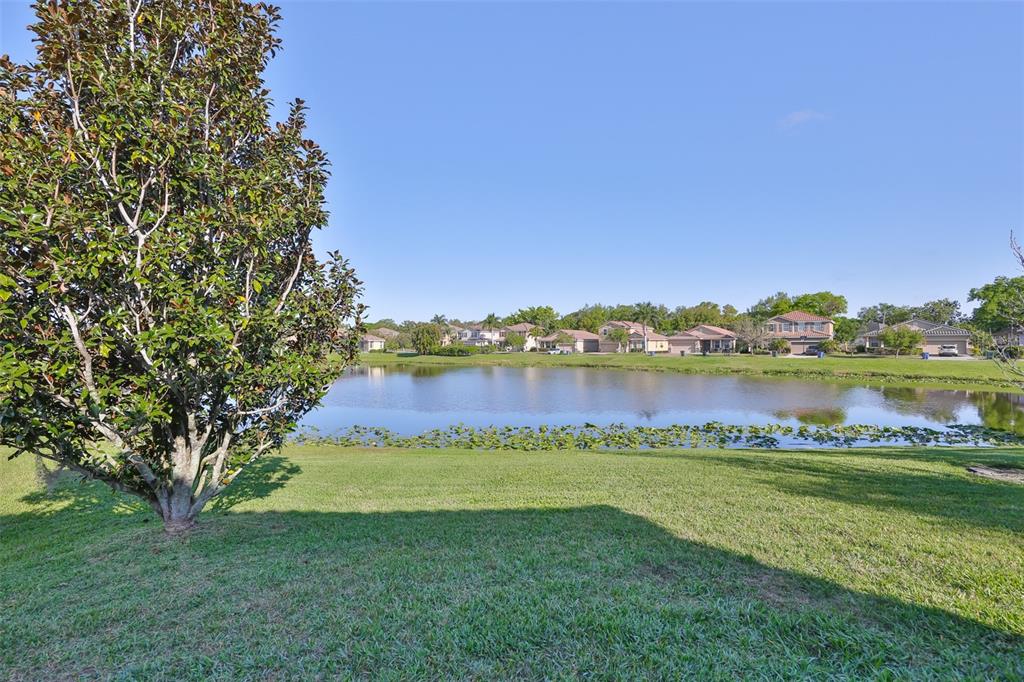 5779 Aaron Court Sarasota, FL 34232 - Photo 30 of 39 a view of a lake with houses in the back