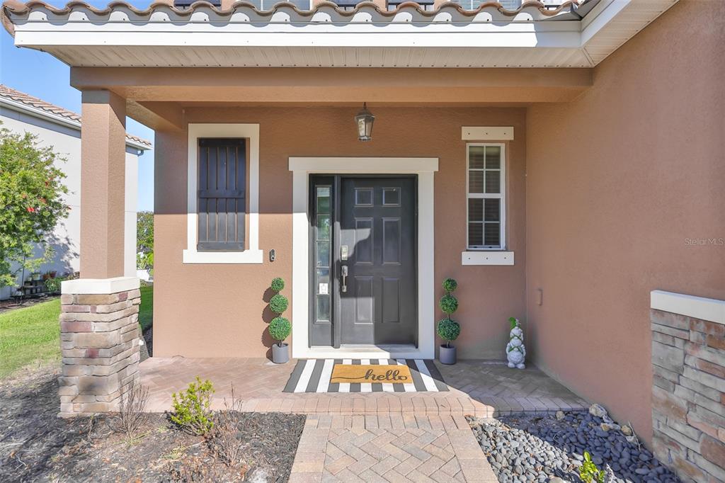 5779 Aaron Court Sarasota, FL 34232 - Photo 4 of 39 a bedroom with a bed and a potted plant