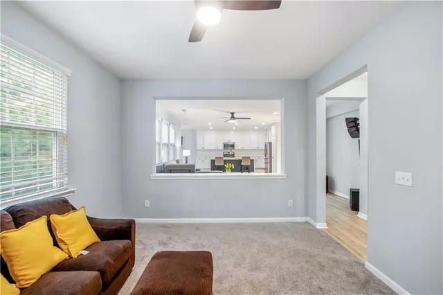 a living room with furniture and a window