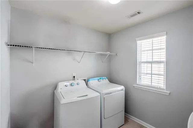 a view of a room with gym equipment and floor to ceiling window