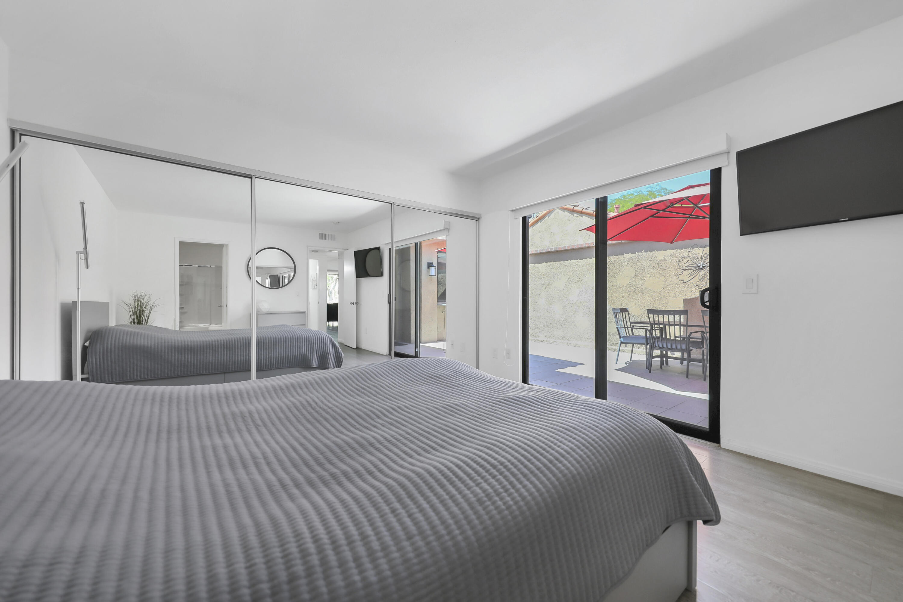 23 Haig Drive Rancho Mirage, CA 92270 - Photo 11 of 29 a bedroom with a large bed and a large window