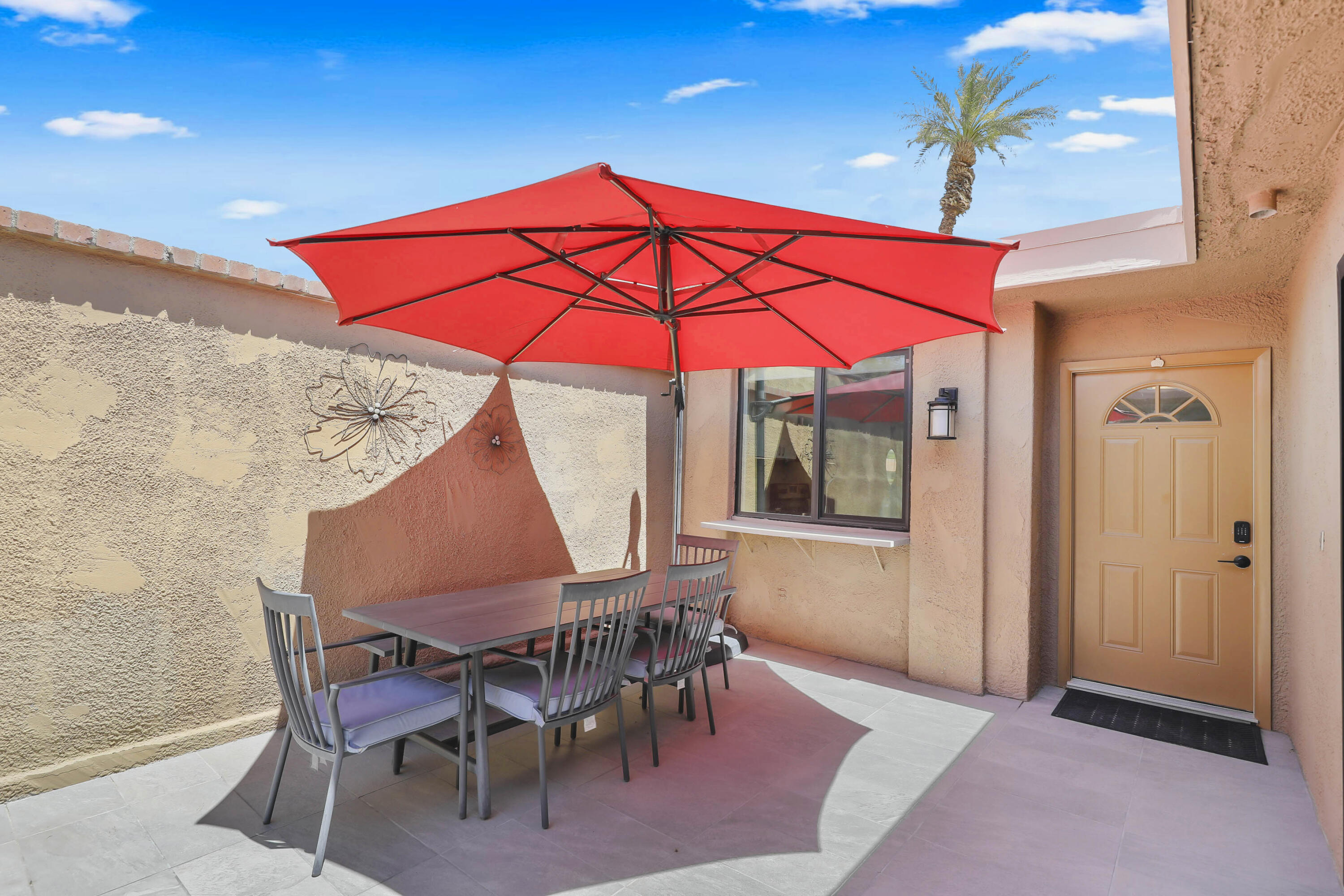 23 Haig Drive Rancho Mirage, CA 92270 - Photo 18 of 29 an outdoor space with furniture and umbrella