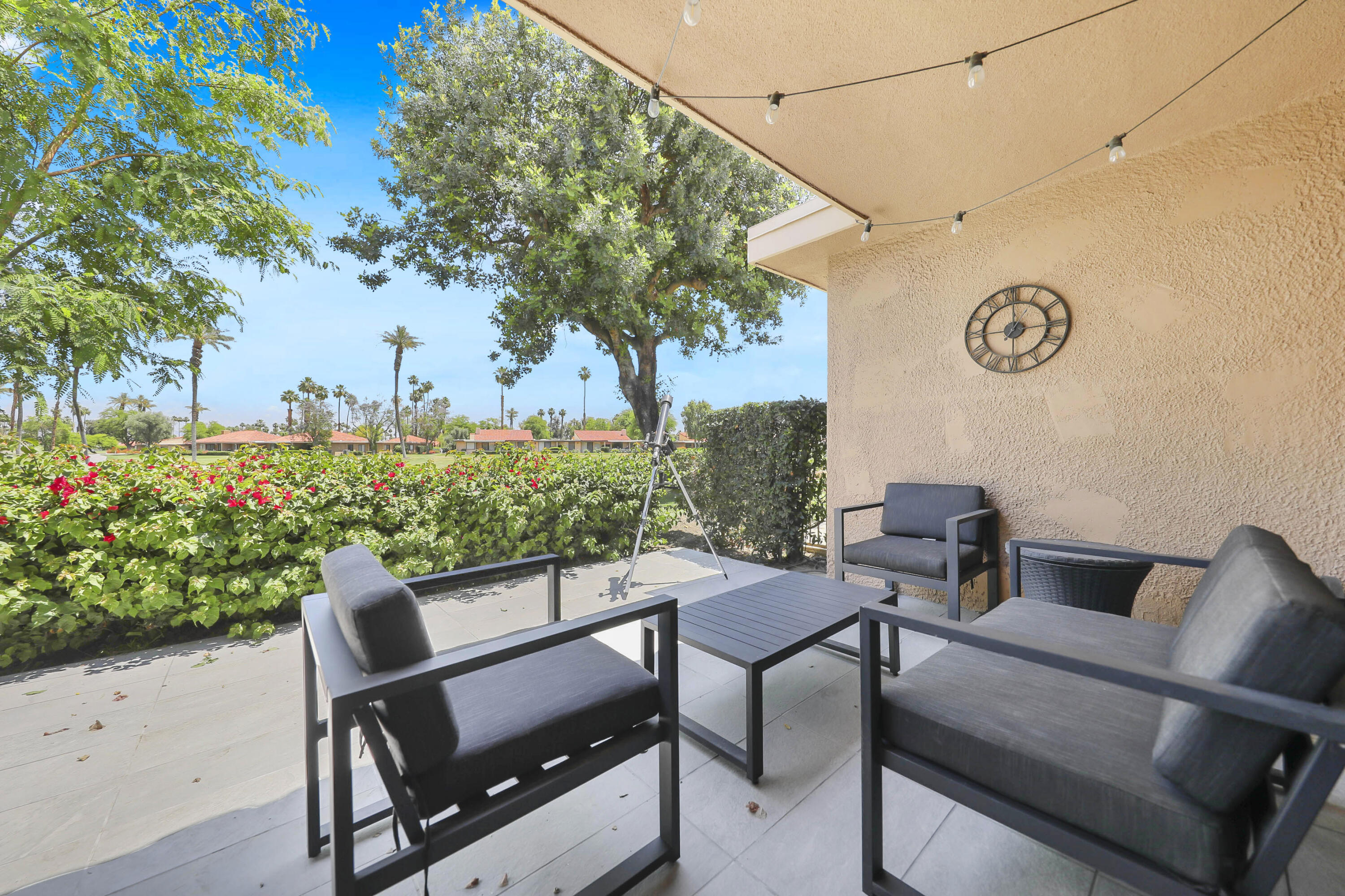 23 Haig Drive Rancho Mirage, CA 92270 - Photo 19 of 29 a view of a chairs and table in the back yard