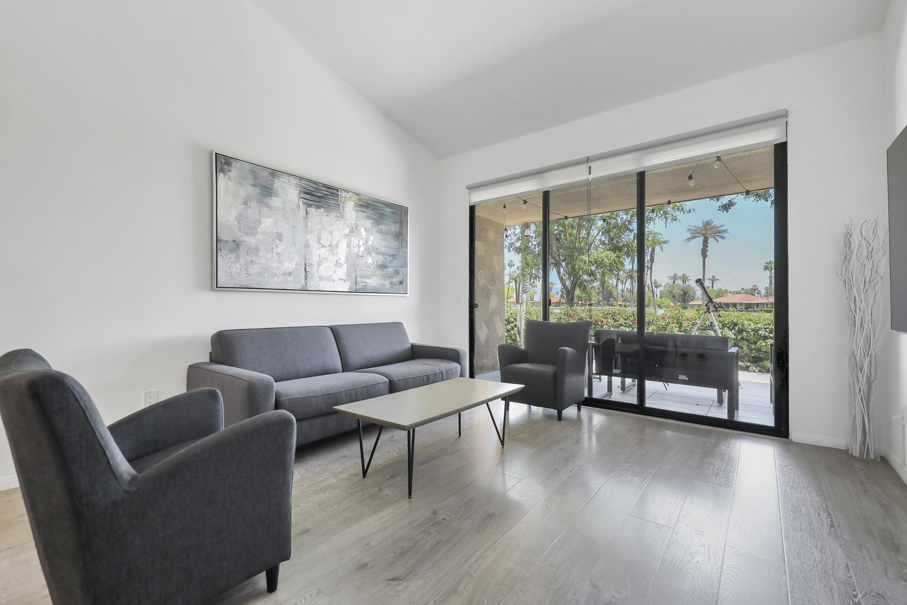 23 Haig Drive Rancho Mirage, CA 92270 - Photo 2 of 29 a living room with furniture and a large window