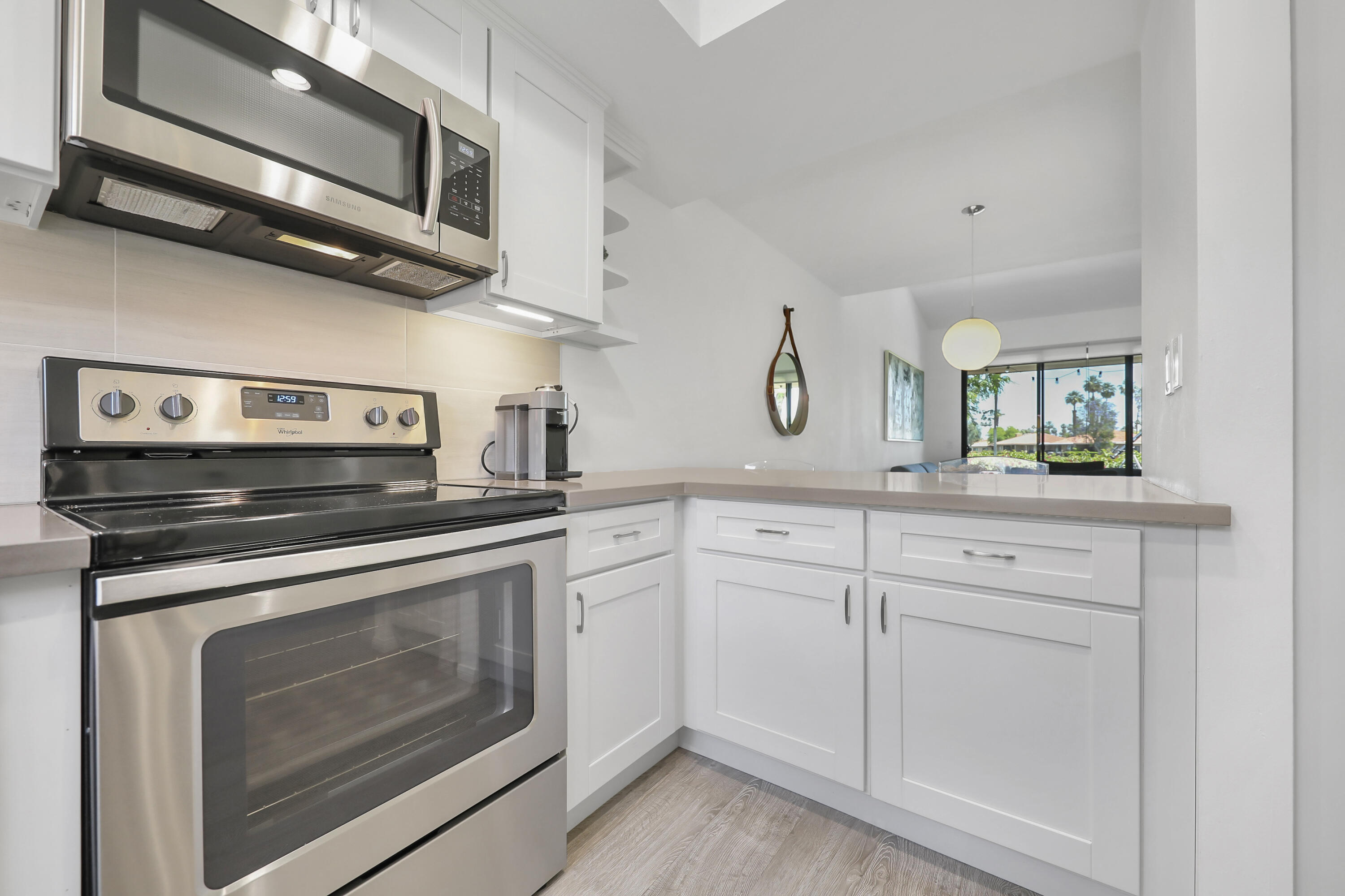 23 Haig Drive Rancho Mirage, CA 92270 - Photo 7 of 29 a kitchen with stainless steel appliances granite countertop a stove and a sink