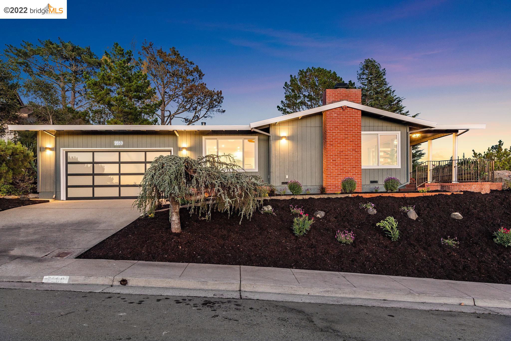 7360 Pebble Beach Drive El Cerrito, CA 94530 - Photo 1 of 1 a front view of a house with garden