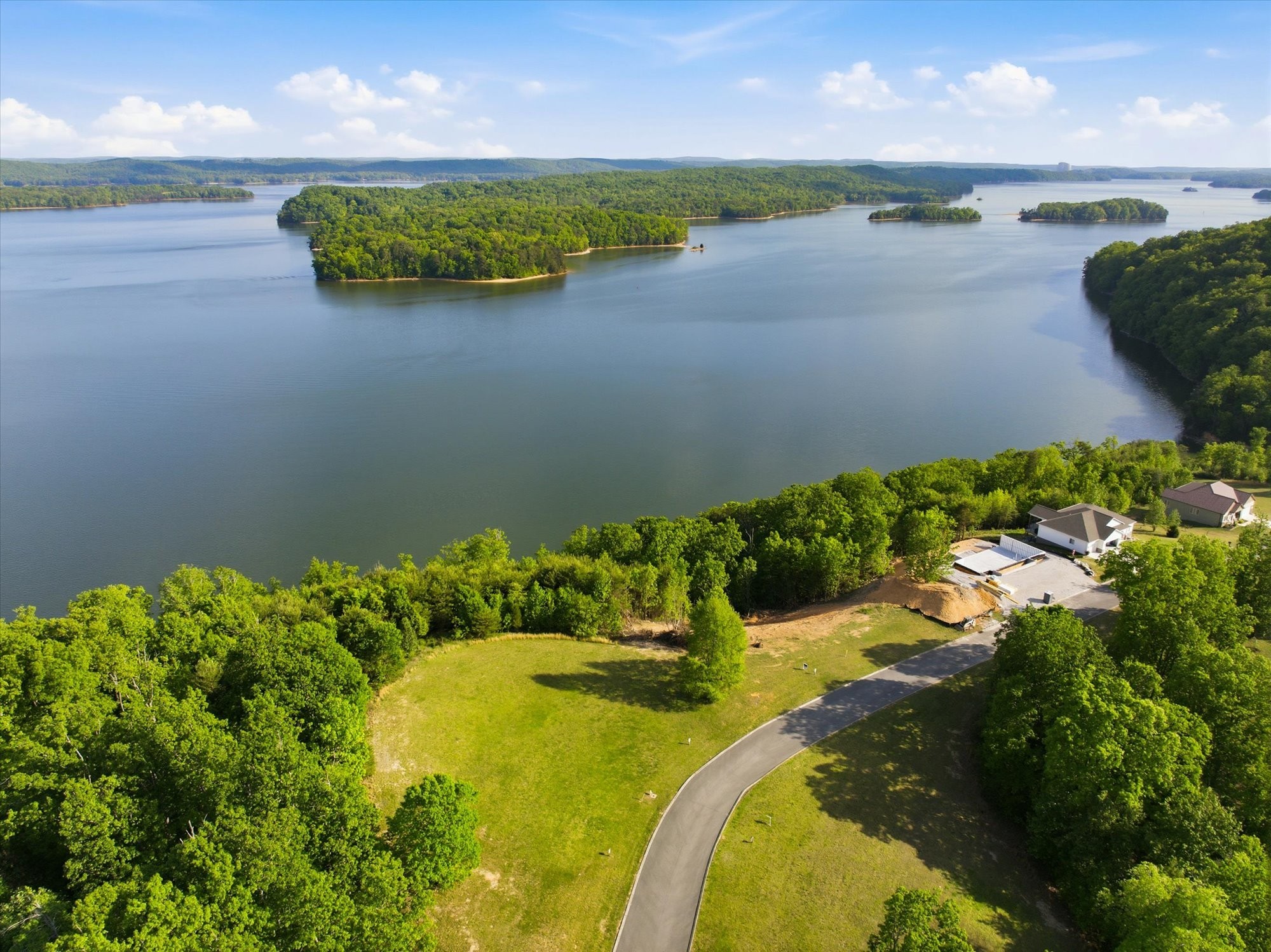 198 River Run Trail Spring City, TN 37381 - Photo 7 of 22 a view of a lake with a yard