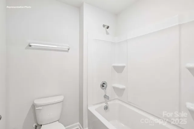a bathroom with a bathtub and toilet