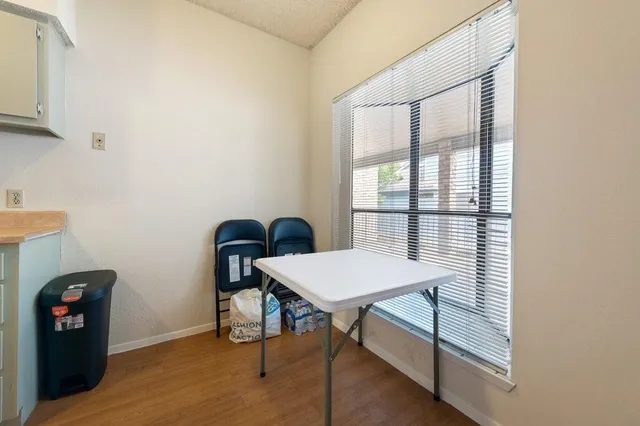 a room that has a bed and a table in it