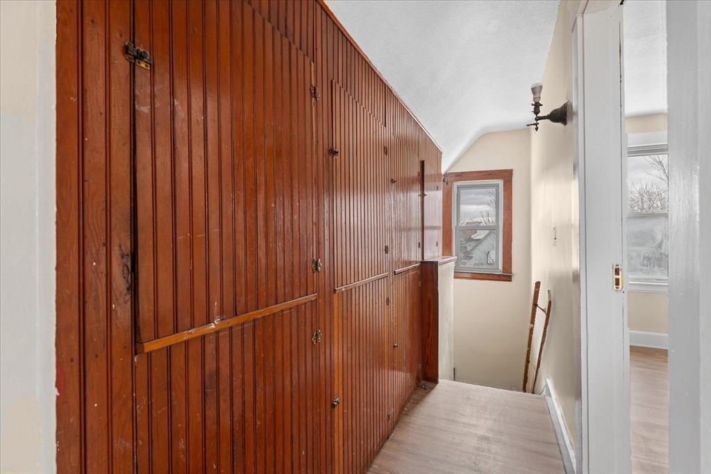 189-191 Northampton Avenue Springfield, MA 01109 - Photo 13 of 39 a view of a hallway with wooden walls