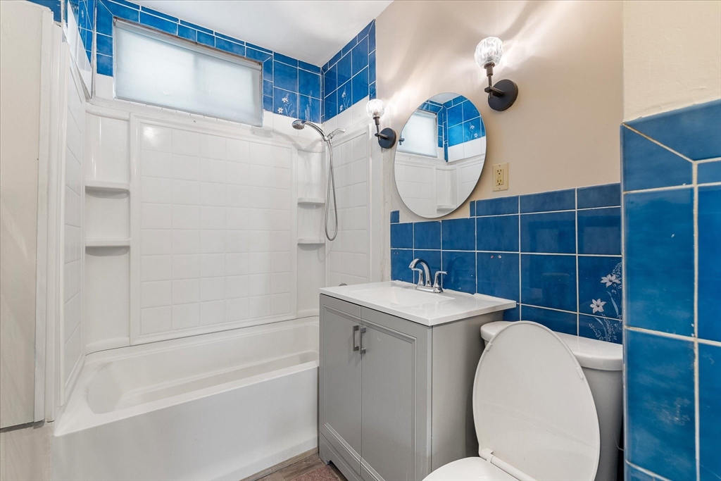 189-191 Northampton Avenue Springfield, MA 01109 - Photo 19 of 39 a bathroom with a sink a toilet and shower