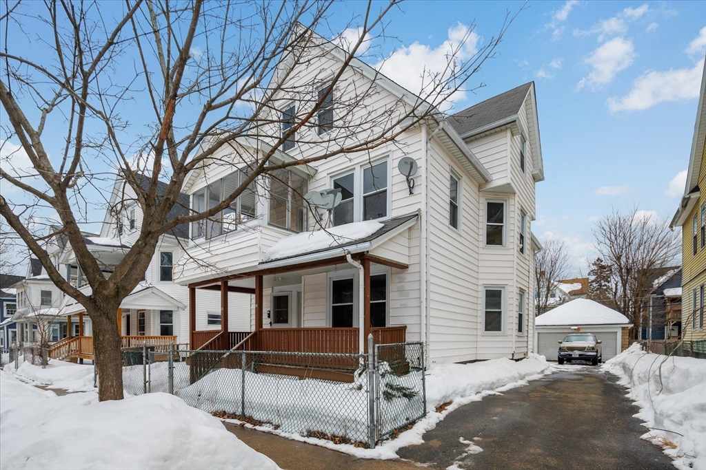 189-191 Northampton Avenue Springfield, MA 01109 - Photo 38 of 39 a view of a white house with a yard and sitting area