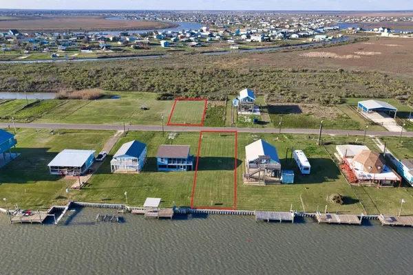 an aerial view of a house with a lake view