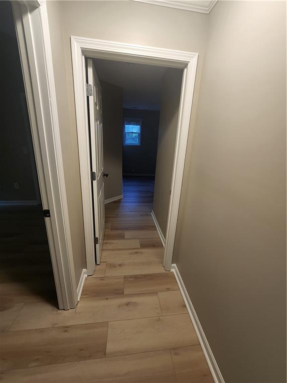 435 Butler Bridge Circle Covington, GA 30016 - Photo 13 of 25 a view of a hallway with wooden floor and staircase