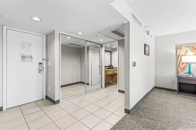 a spacious bedroom with a large bed and a couch