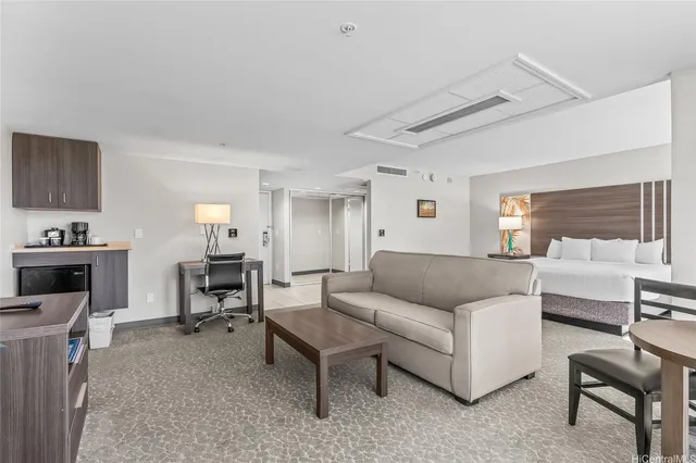 a living room with furniture and a piano
